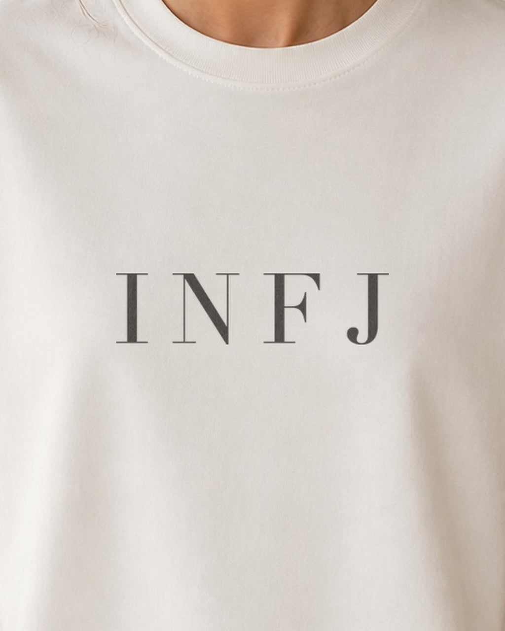 The Typese INFJ Comfort Colors Tee in cream white, female front detail