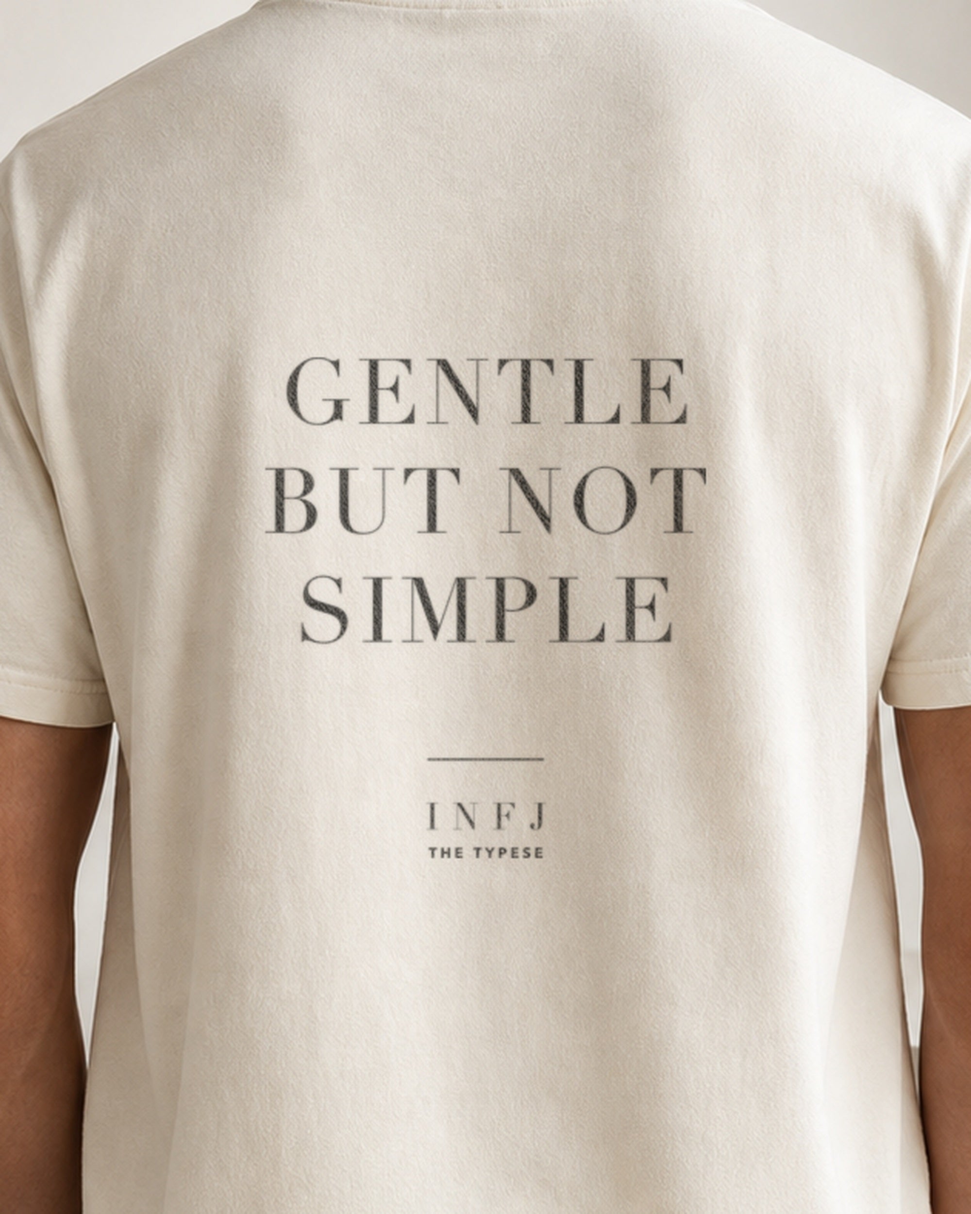 The Typese INFJ Comfort Colors Tee in cream white, male back detail