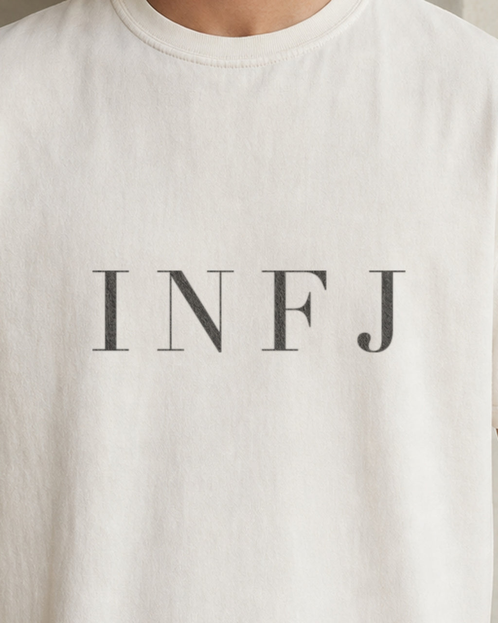 The Typese INFJ Comfort Colors Tee in cream white, male front detail