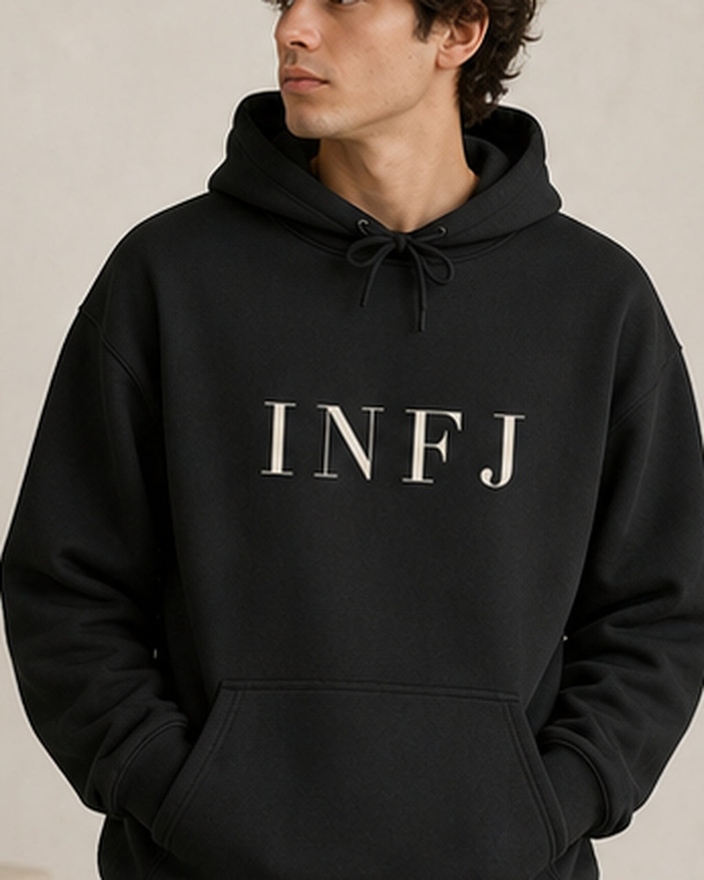 The Typese INFJ Gildan hoodie in black, male front detail