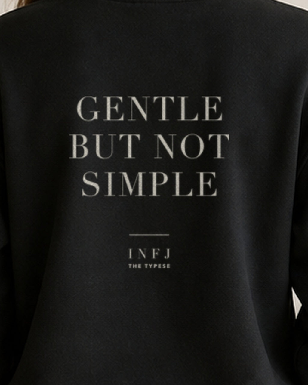 The Typese INFJ Gildan crewneck sweatshirt in black, female back print close