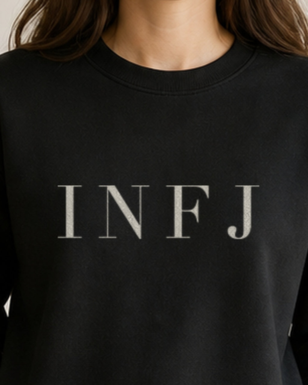 The Typese INFJ Gildan crewneck sweatshirt in black, female front neckline fabric