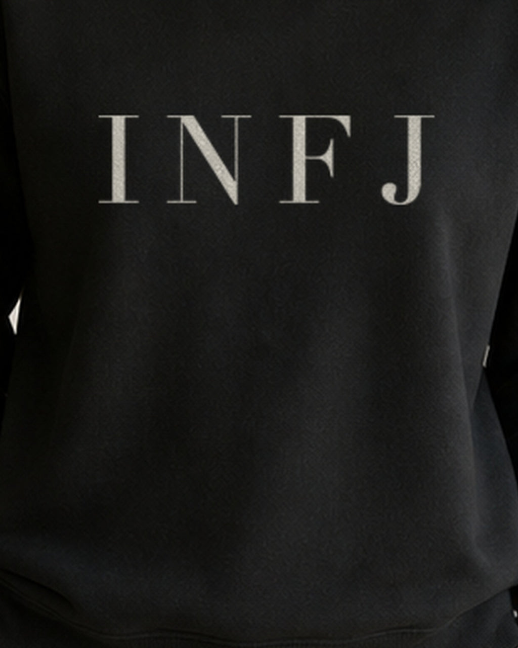 The Typese INFJ Gildan crewneck sweatshirt in black, female front print close