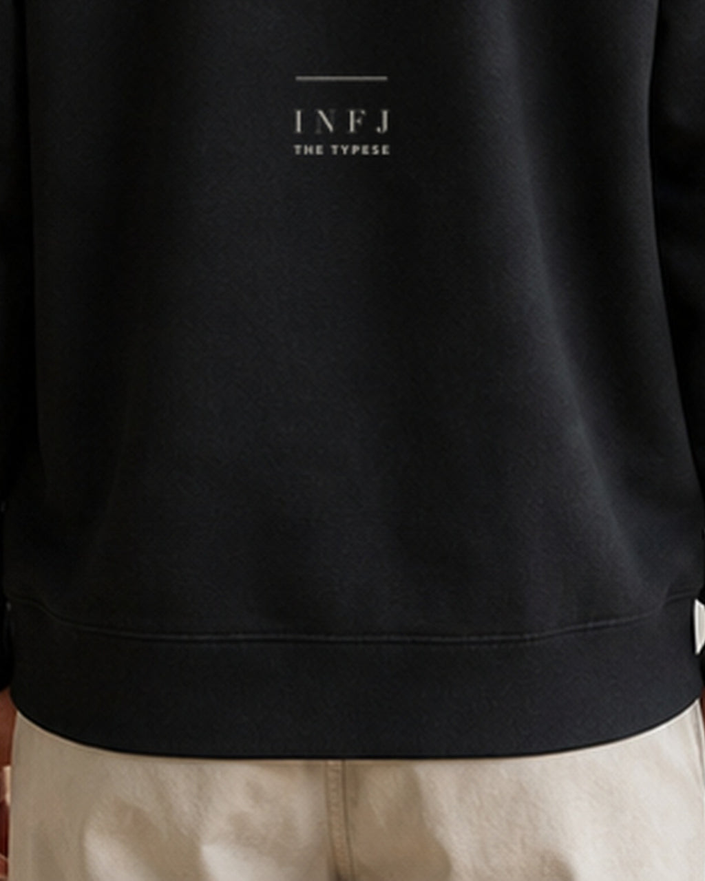 The Typese INFJ Gildan crewneck sweatshirt in black, male back hem fleece texture