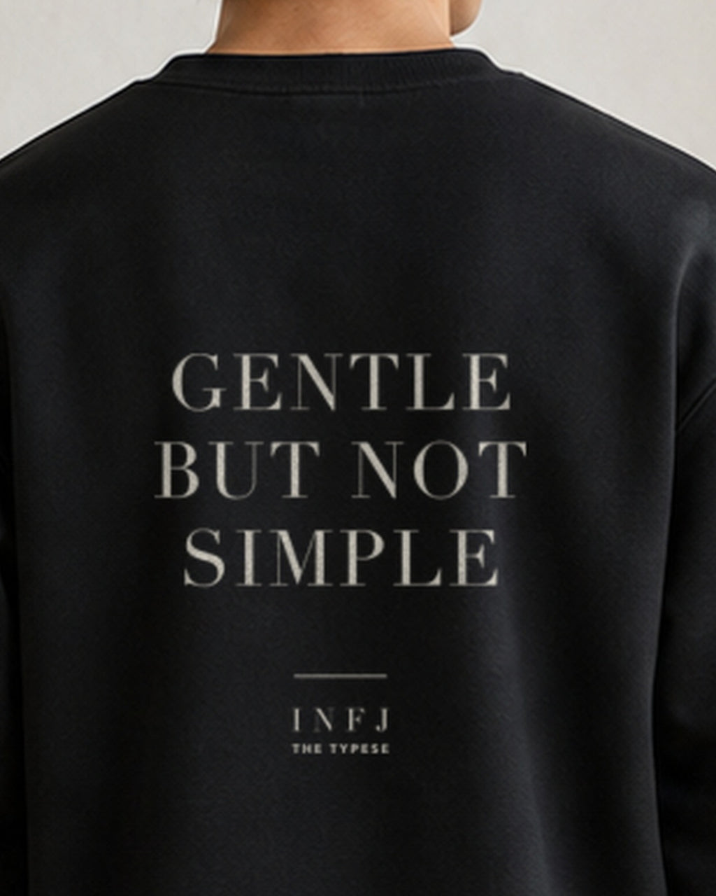 The Typese INFJ Gildan crewneck sweatshirt in black, male back neckline print