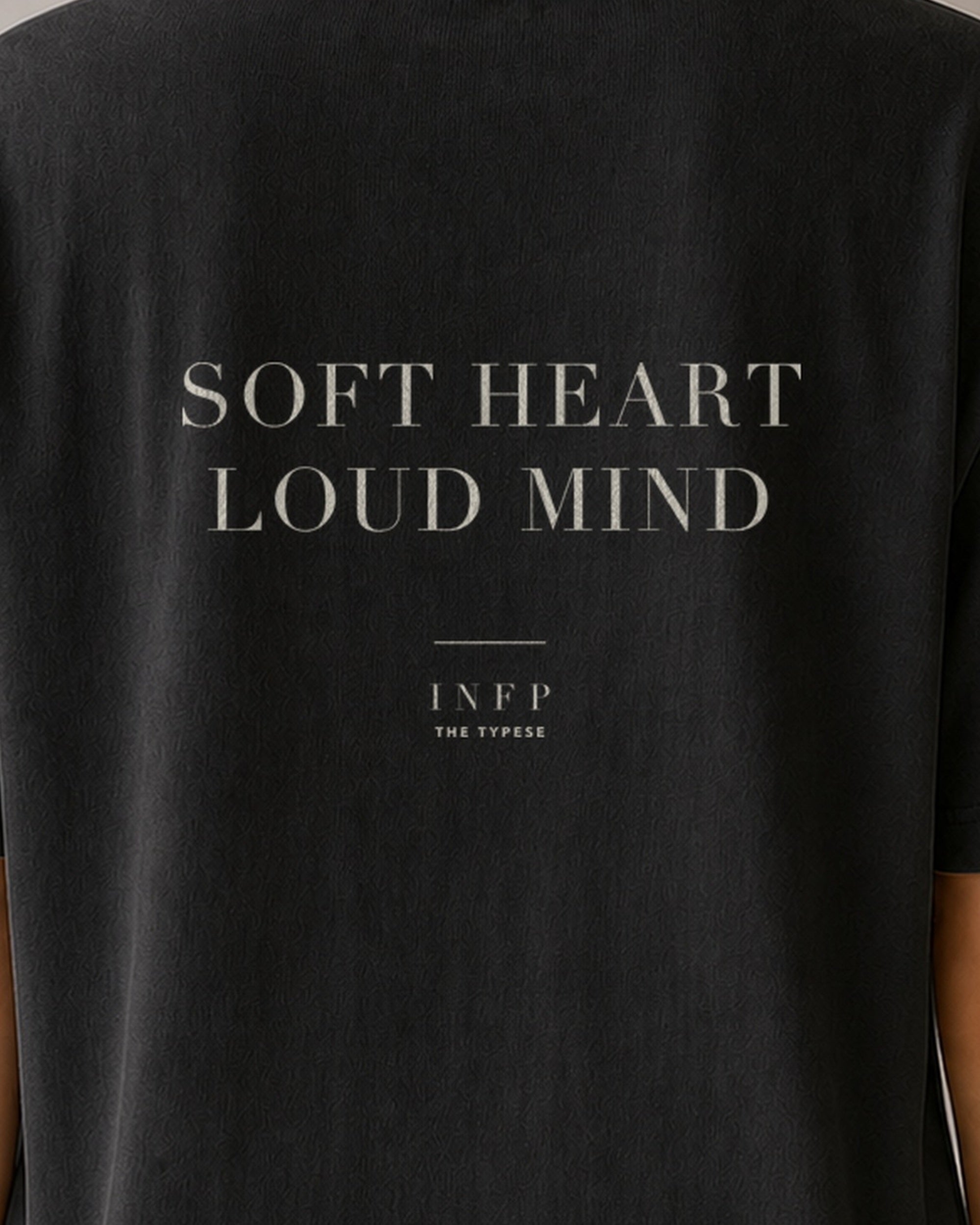 The Typese INFP Comfort Colors Tee in black, female back detail