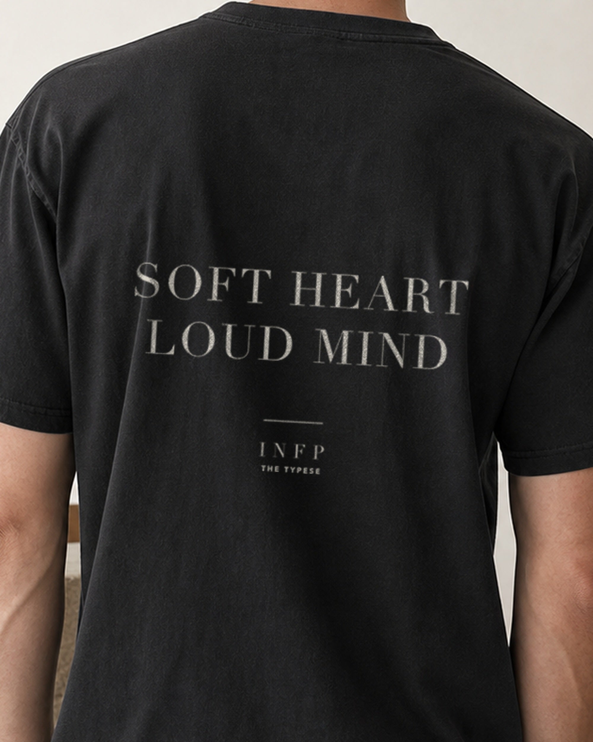 The Typese INFP Comfort Colors Tee in black, male back detail