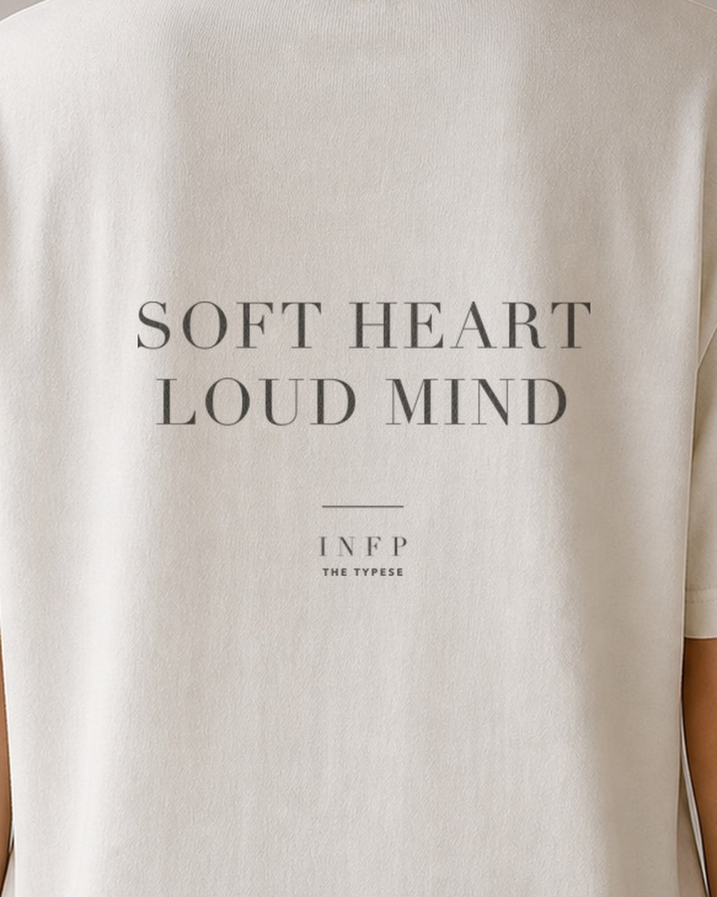 The Typese INFP Comfort Colors Tee in cream white, female back detail