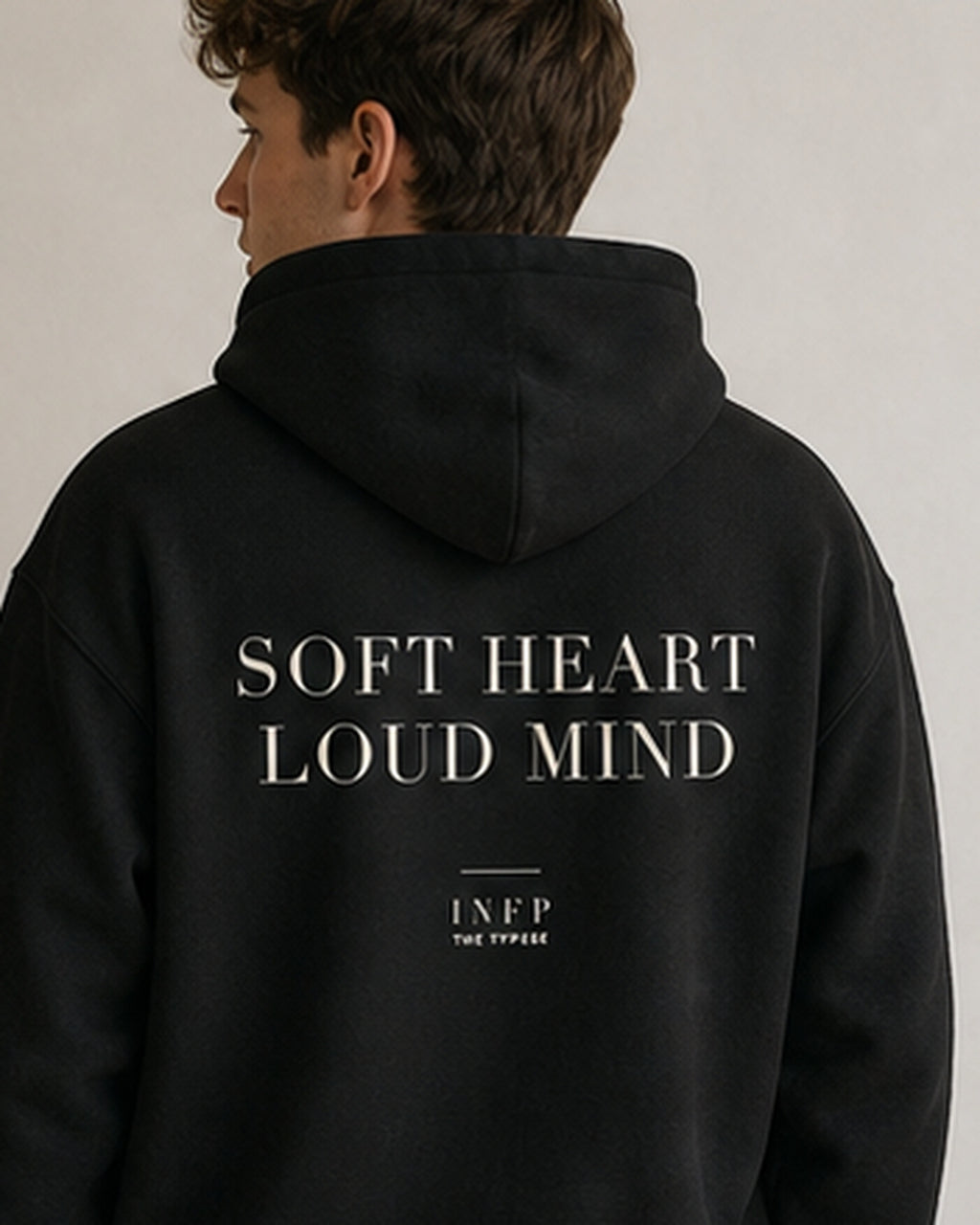 The Typese INFP Gildan hoodie in black, male back detail