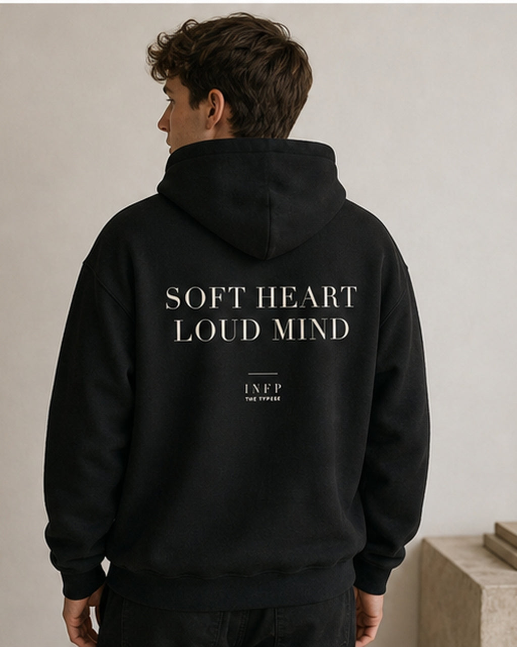 The Typese INFP Gildan hoodie in black, male back