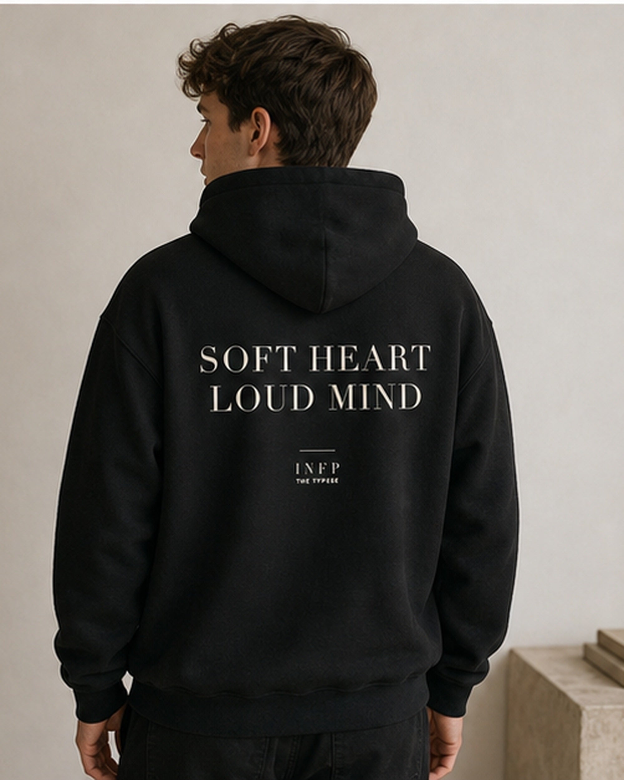 The Typese INFP Gildan hoodie in black, male back