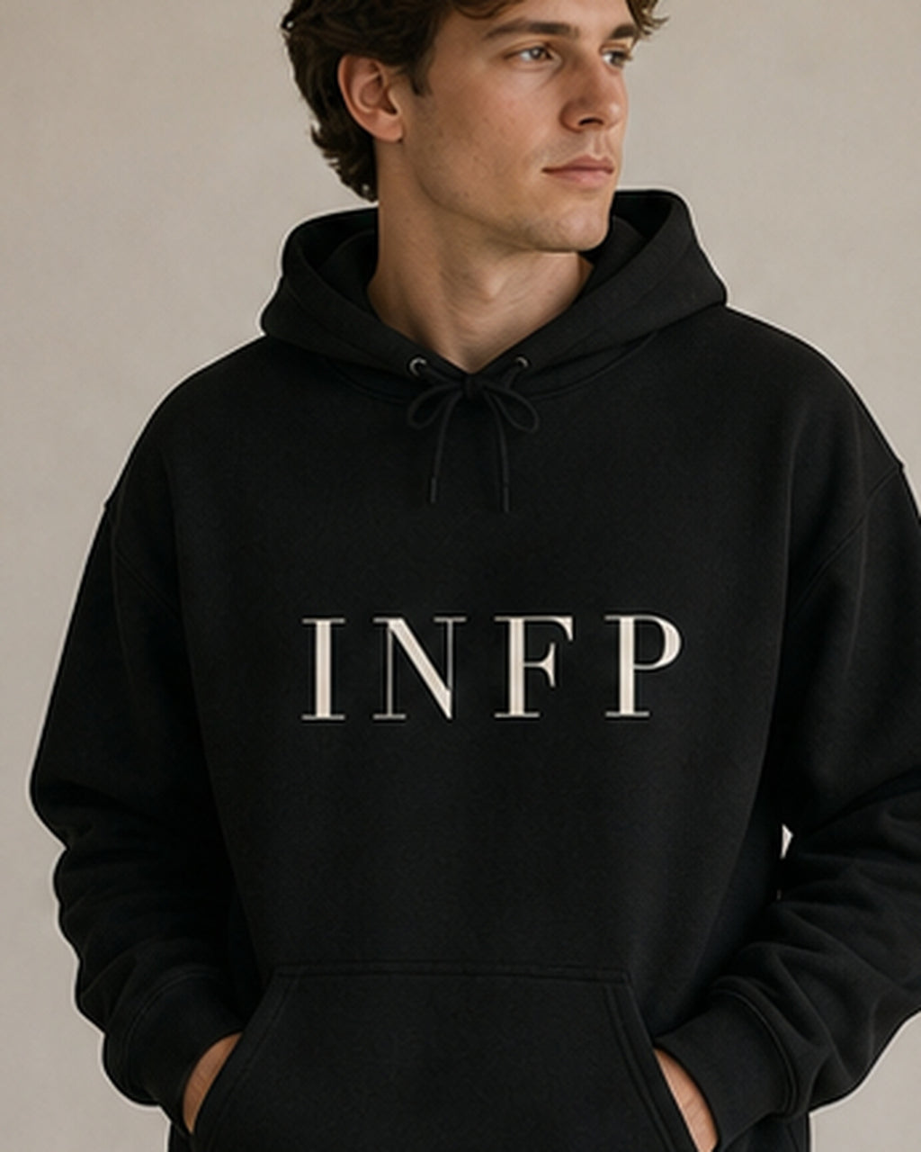 The Typese INFP Gildan hoodie in black, male front detail