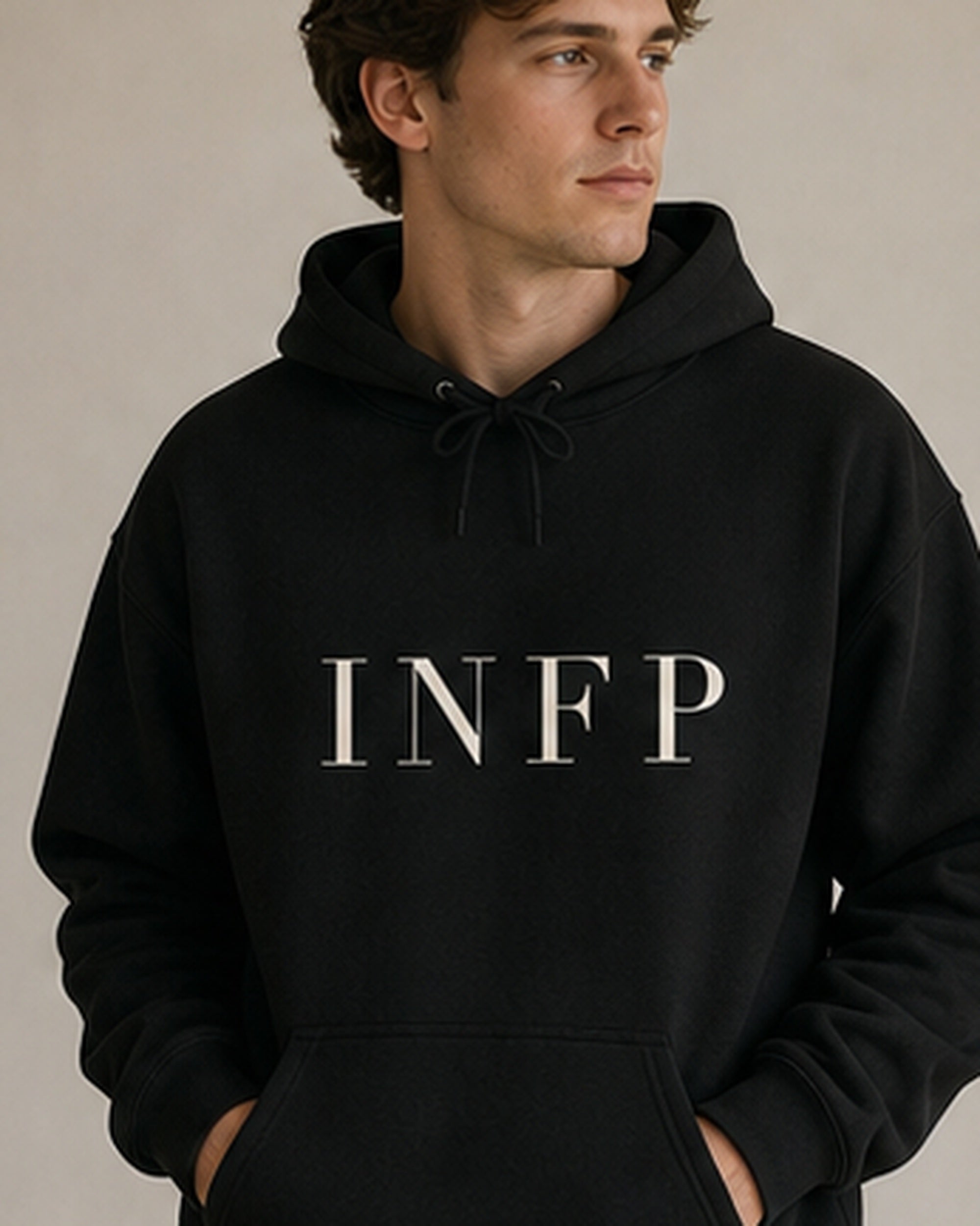 The Typese INFP Gildan hoodie in black, male front detail