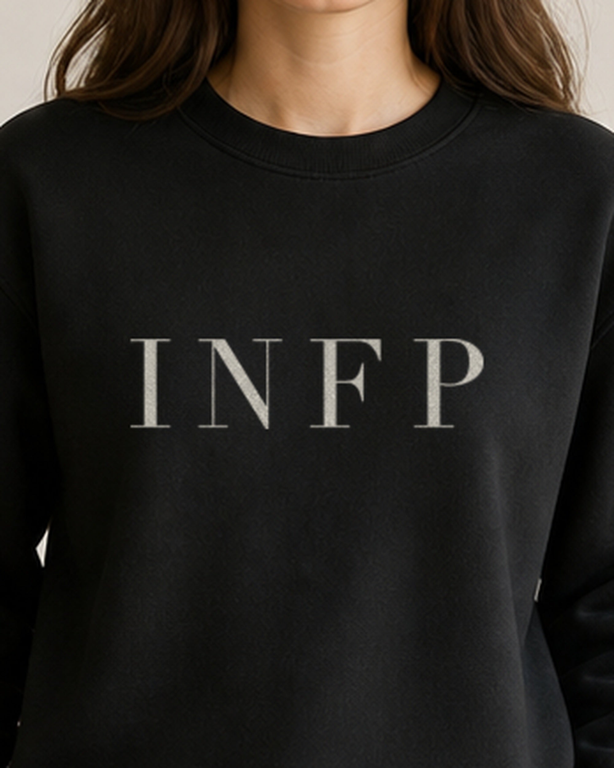 The Typese INFP Gildan crewneck sweatshirt in black, female front detail