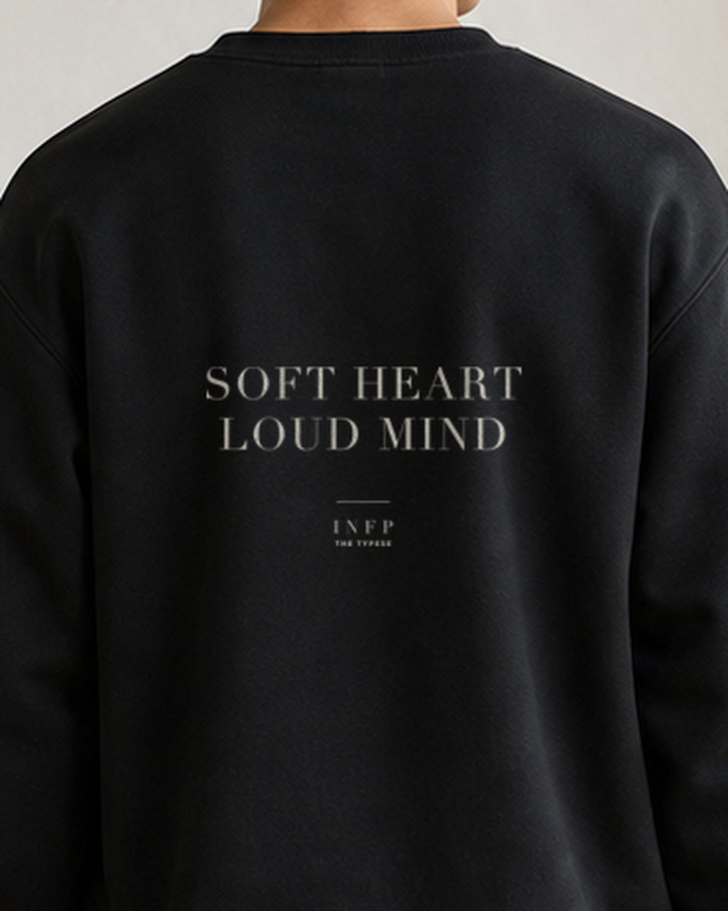 The Typese INFP Gildan crewneck sweatshirt in black, male back detail