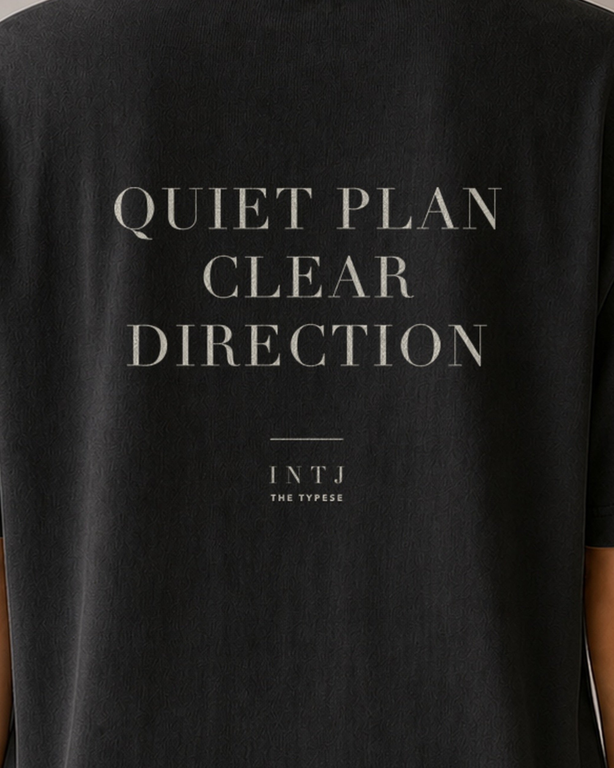 The Typese INTJ Comfort Colors Tee in black, female back detail