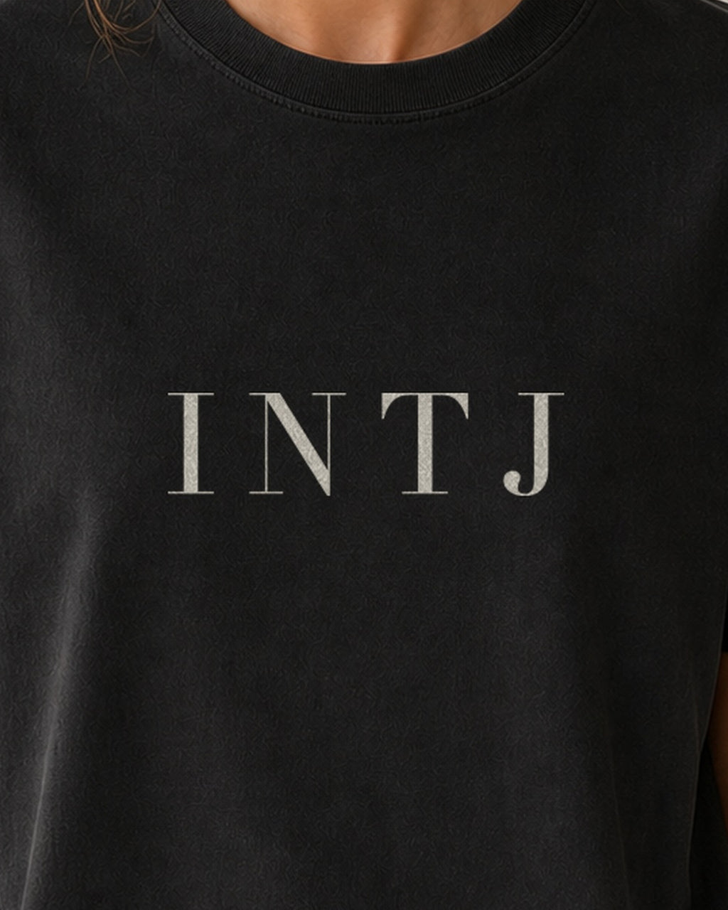 The Typese INTJ Comfort Colors Tee in black, female front detail