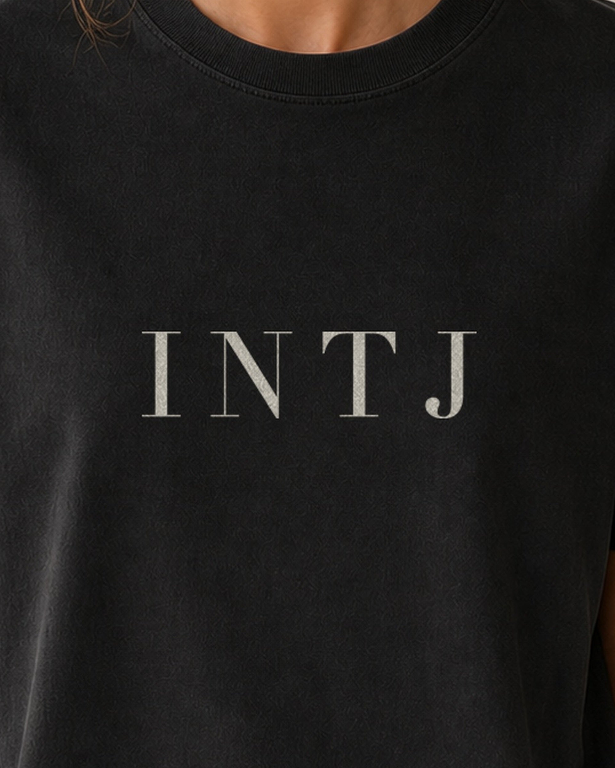 The Typese INTJ Comfort Colors Tee in black, female front detail