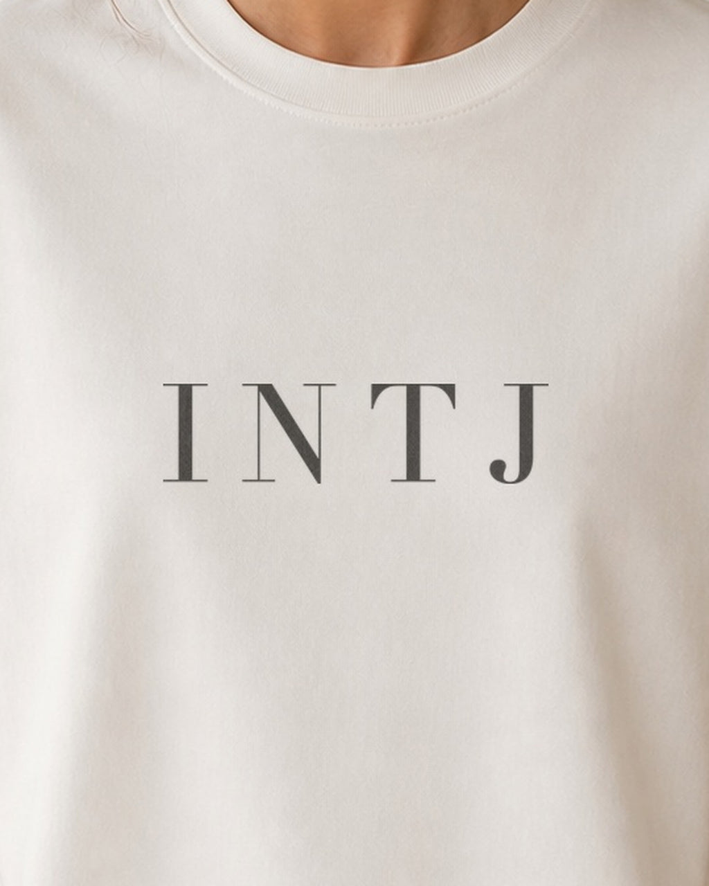 The Typese INTJ Comfort Colors Tee in cream white, female front detail