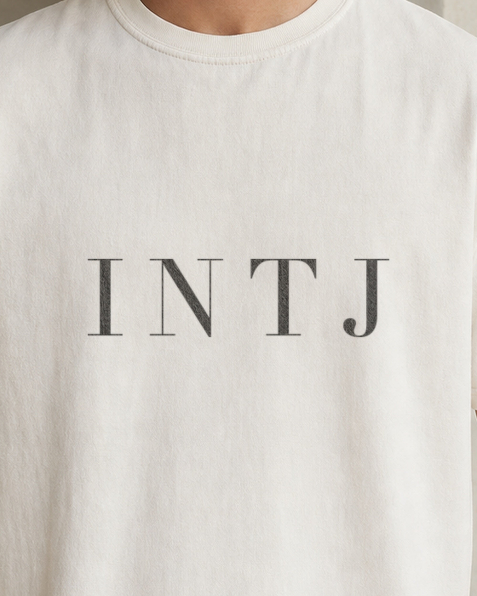 The Typese INTJ Comfort Colors Tee in cream white, male front detail