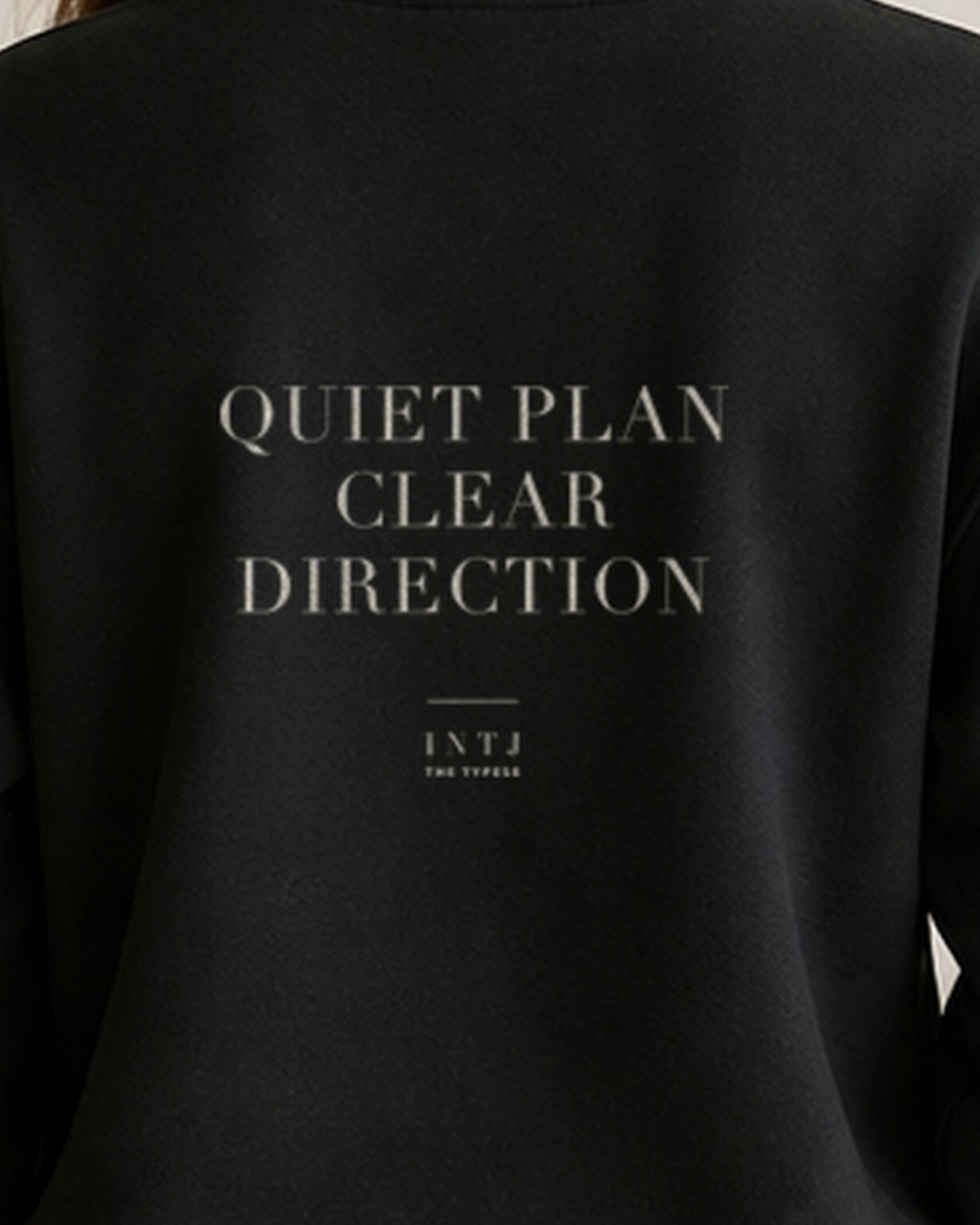 The Typese INTJ Gildan crewneck sweatshirt in black, female back print close