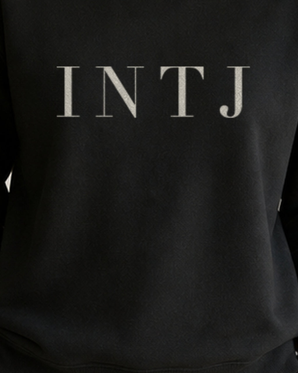 The Typese INTJ Gildan crewneck sweatshirt in black, female front print close