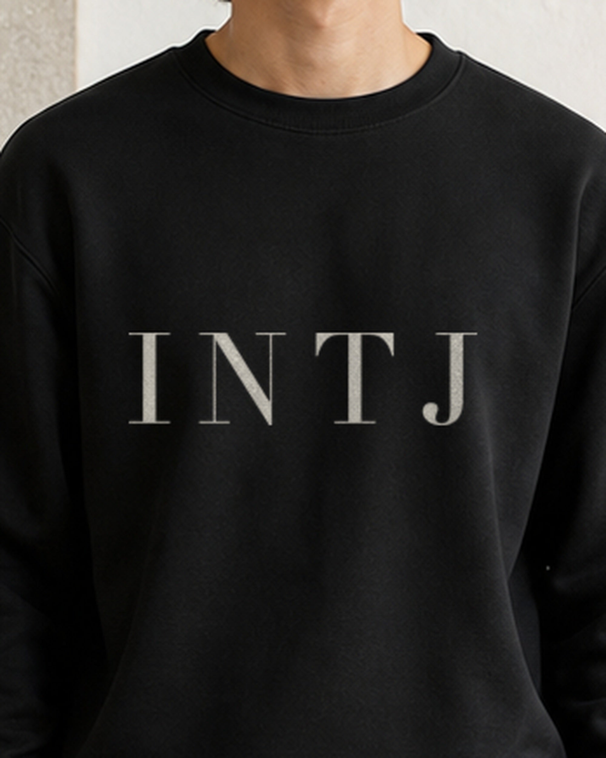 The Typese INTJ Gildan crewneck sweatshirt in black, male front detail