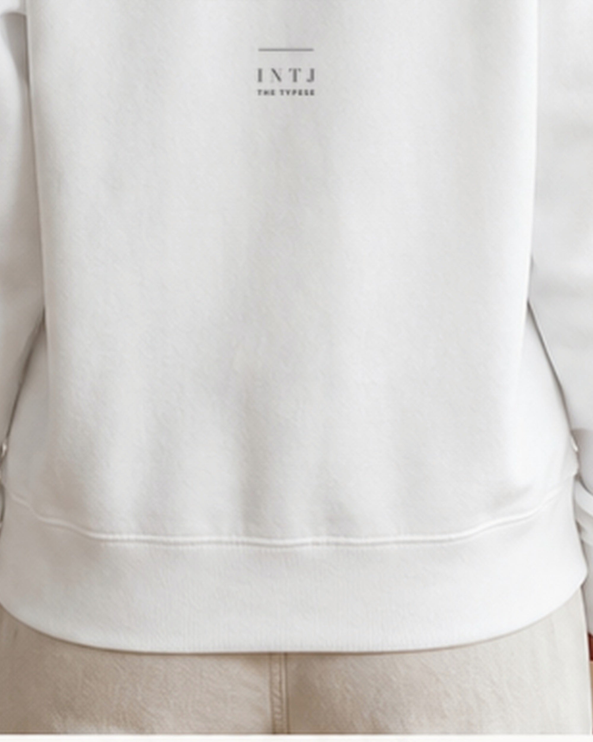 The Typese INTJ Gildan crewneck sweatshirt in white, female back hem fleece texture v7