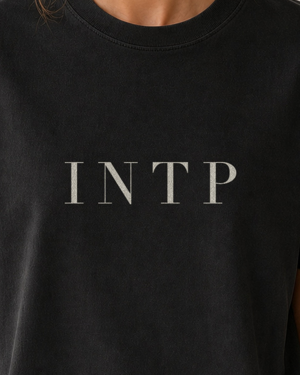 The Typese INTP Comfort Colors Tee in black, female front detail