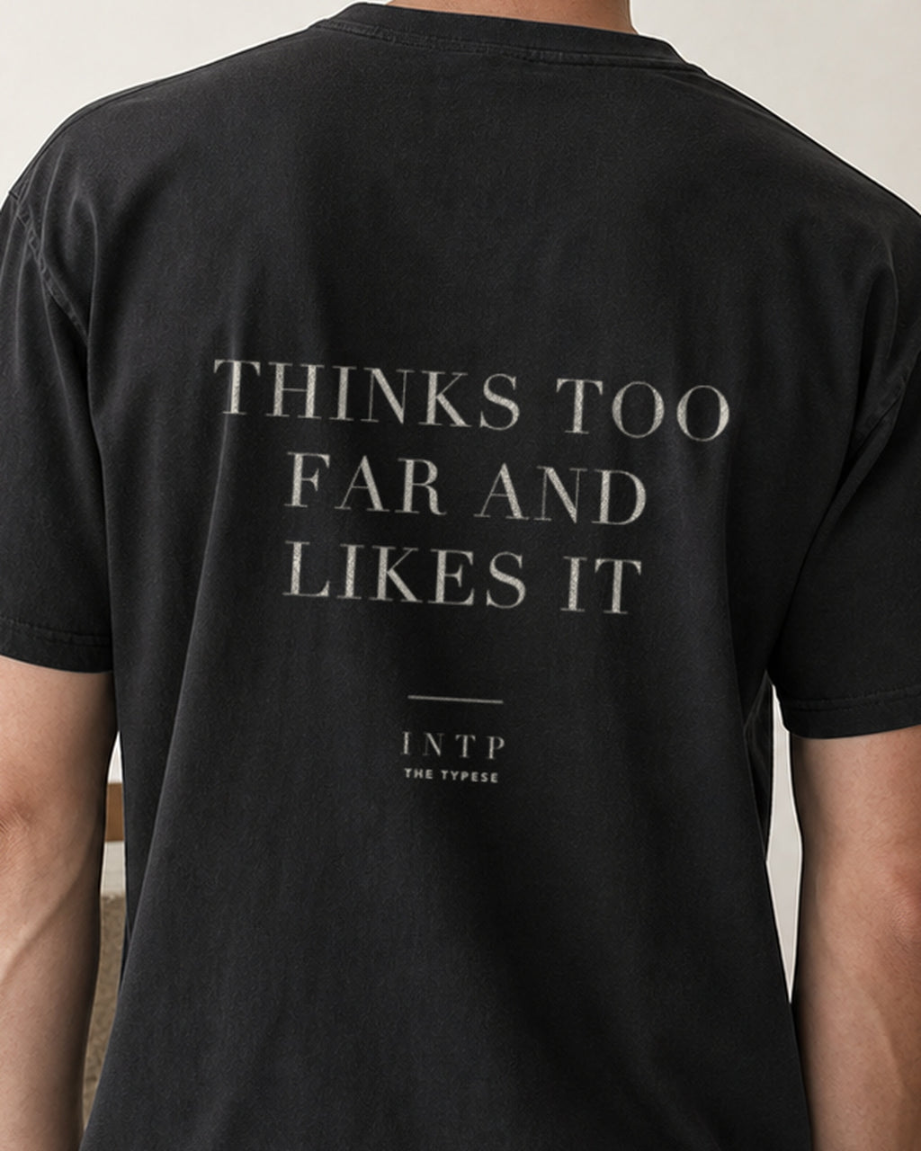 The Typese INTP Comfort Colors Tee in black, male back detail