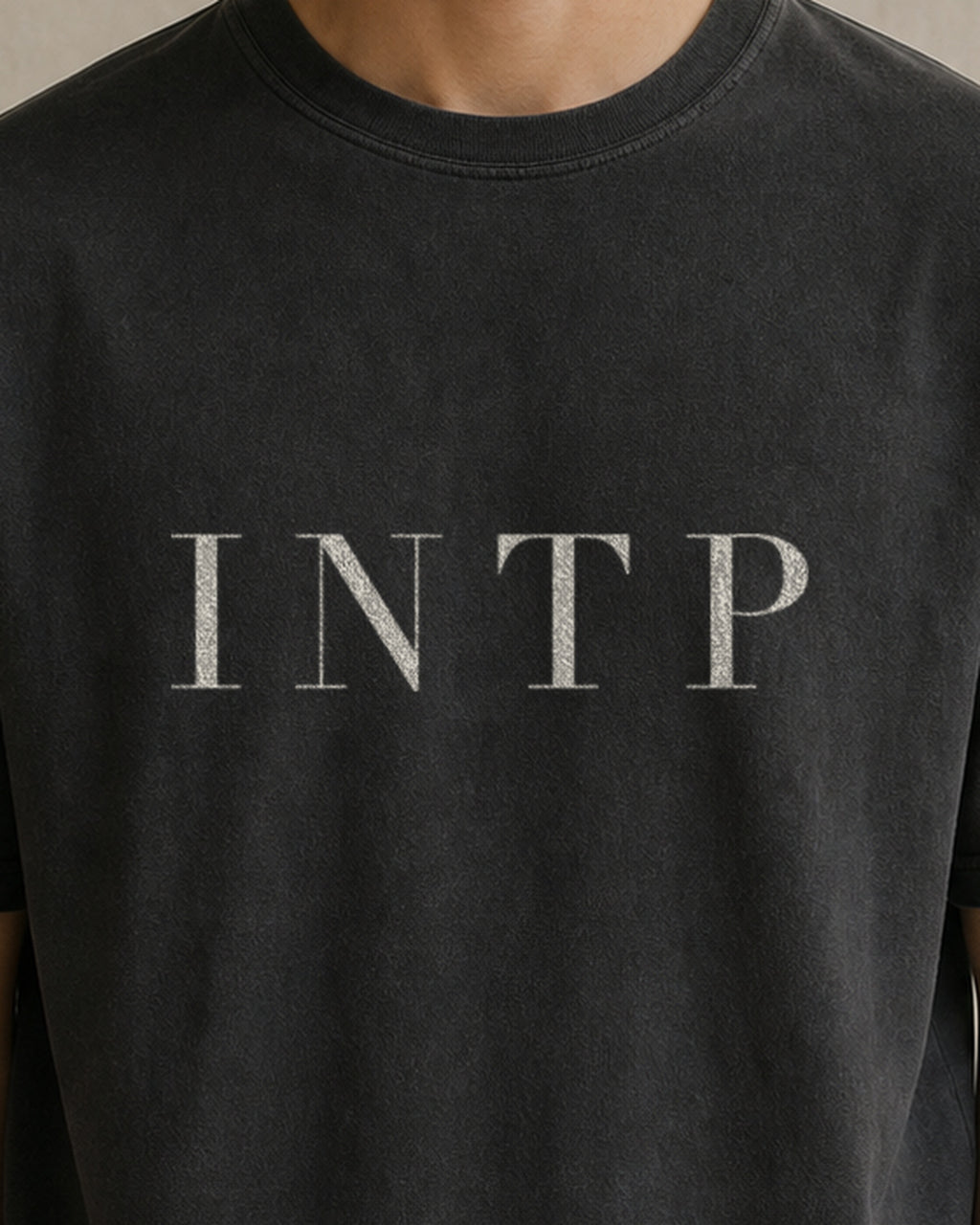 The Typese INTP Comfort Colors Tee in black, male front detail