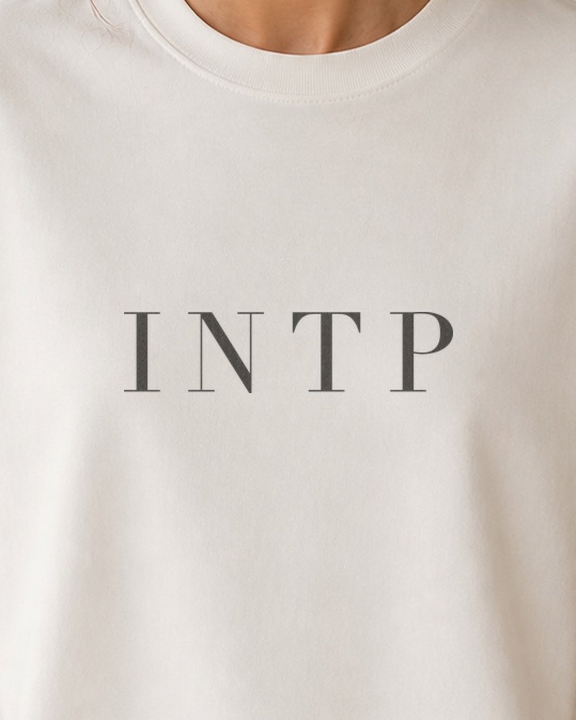 The Typese INTP Comfort Colors Tee in cream white, female front detail