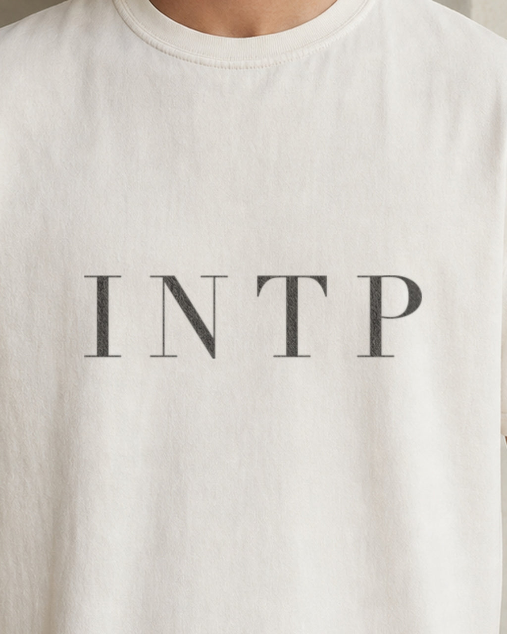The Typese INTP Comfort Colors Tee in cream white, male front detail