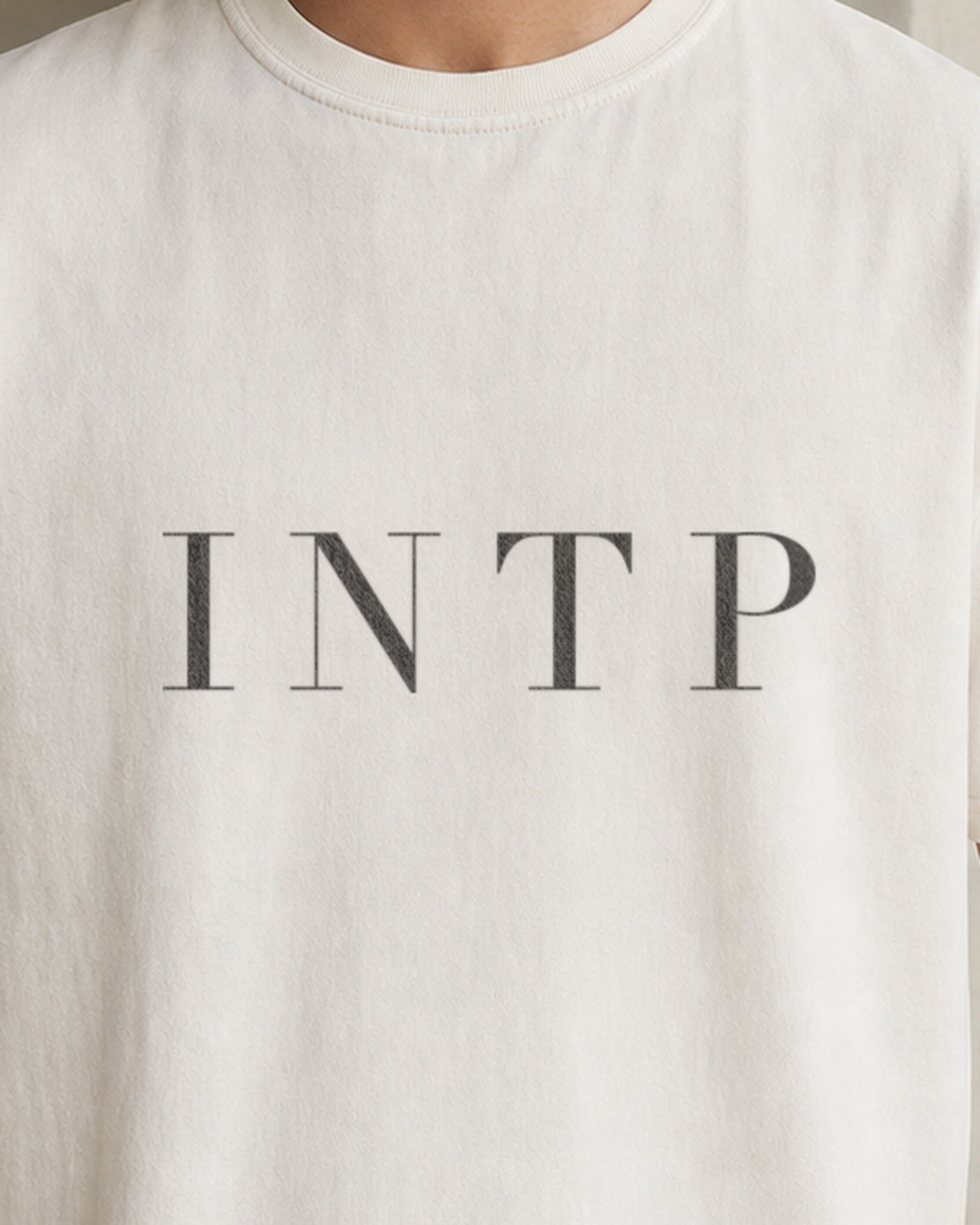 The Typese INTP Comfort Colors Tee in cream white, male front detail