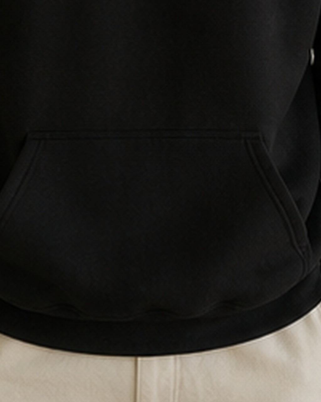 The Typese INTP Gildan hoodie in black, hem pocket detail
