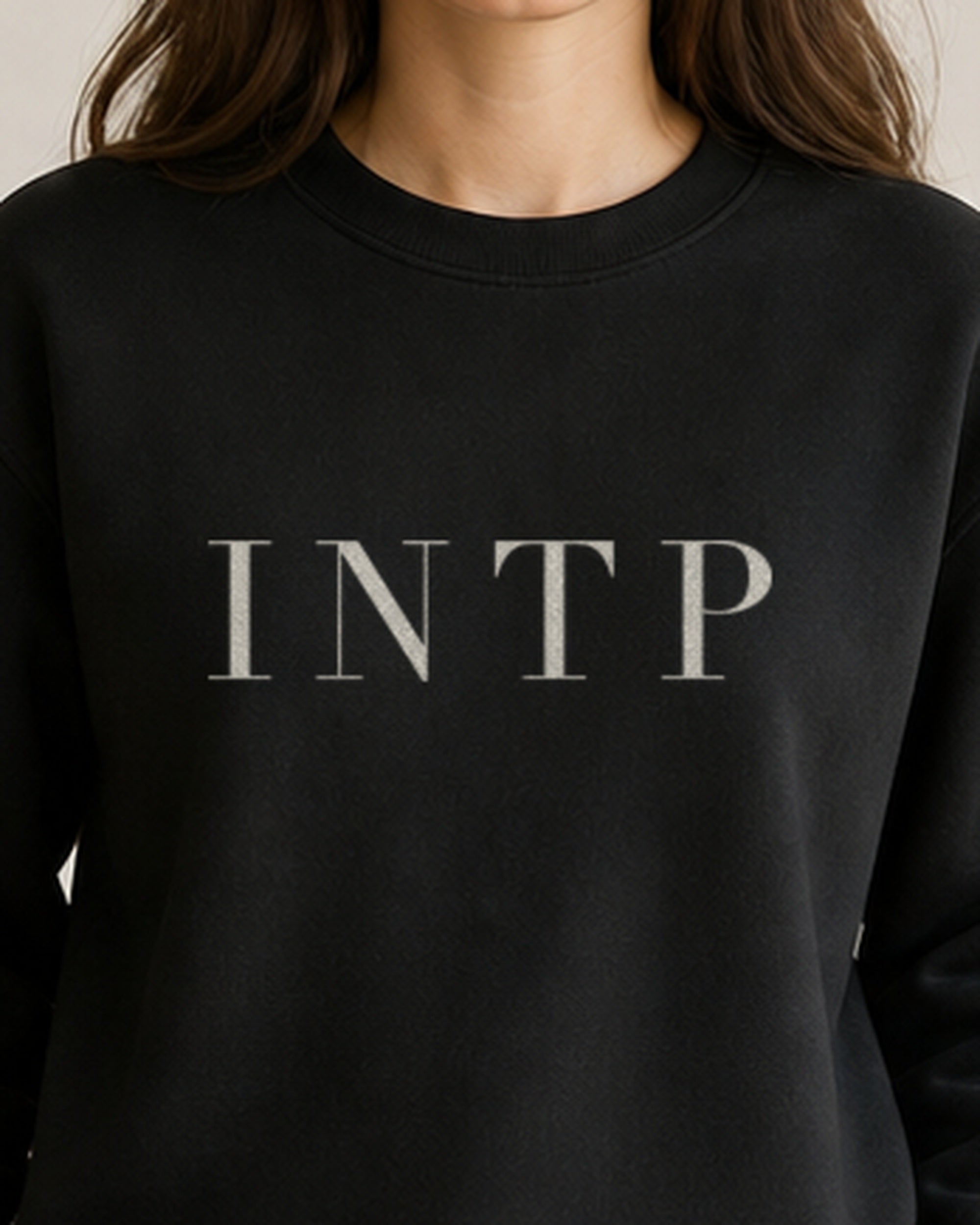 The Typese INTP Gildan crewneck sweatshirt in black, female front detail