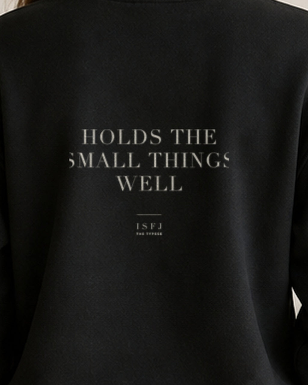 The Typese ISFJ Gildan crewneck sweatshirt in black, female back print close