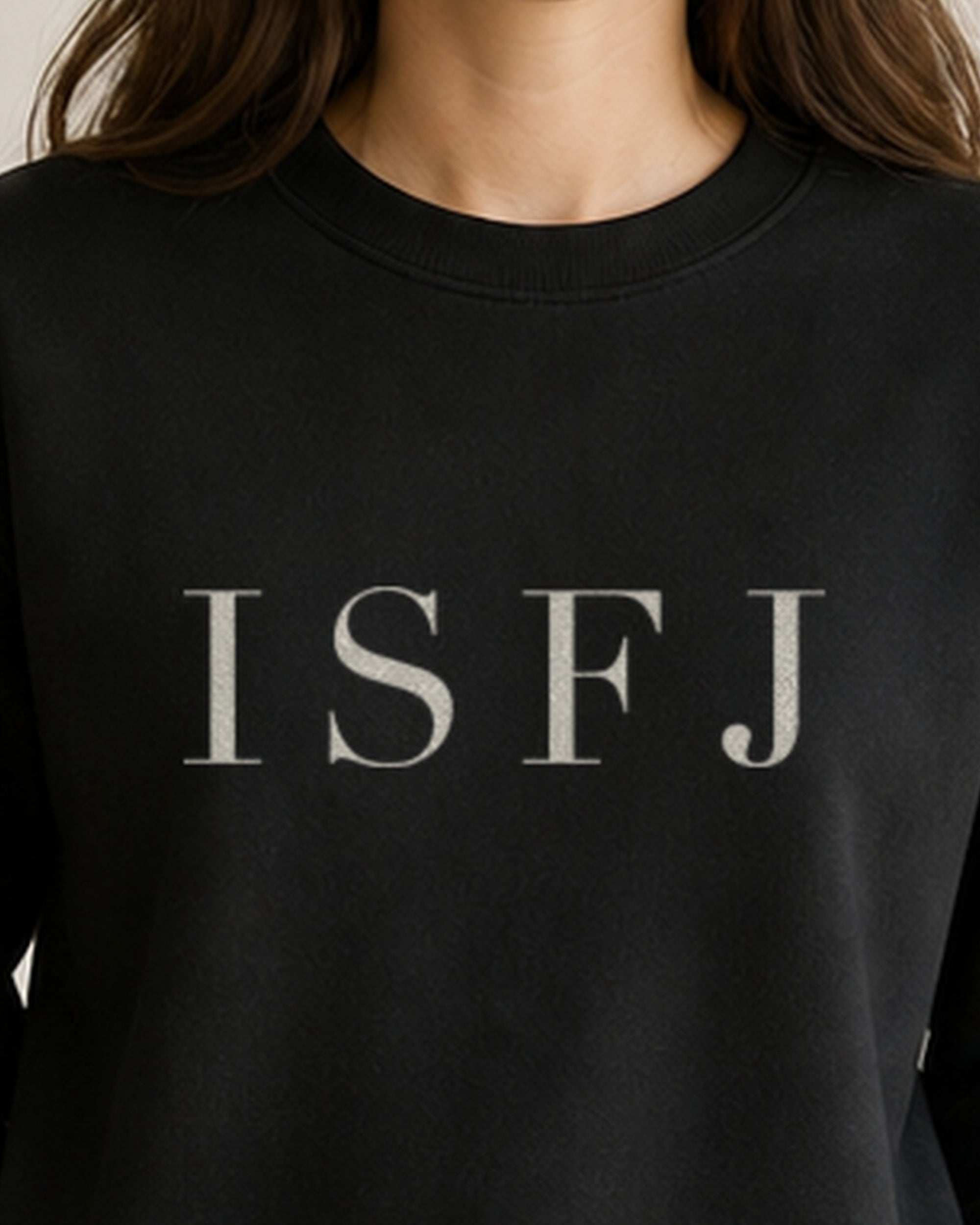 The Typese ISFJ Gildan crewneck sweatshirt in black, female front neckline fabric