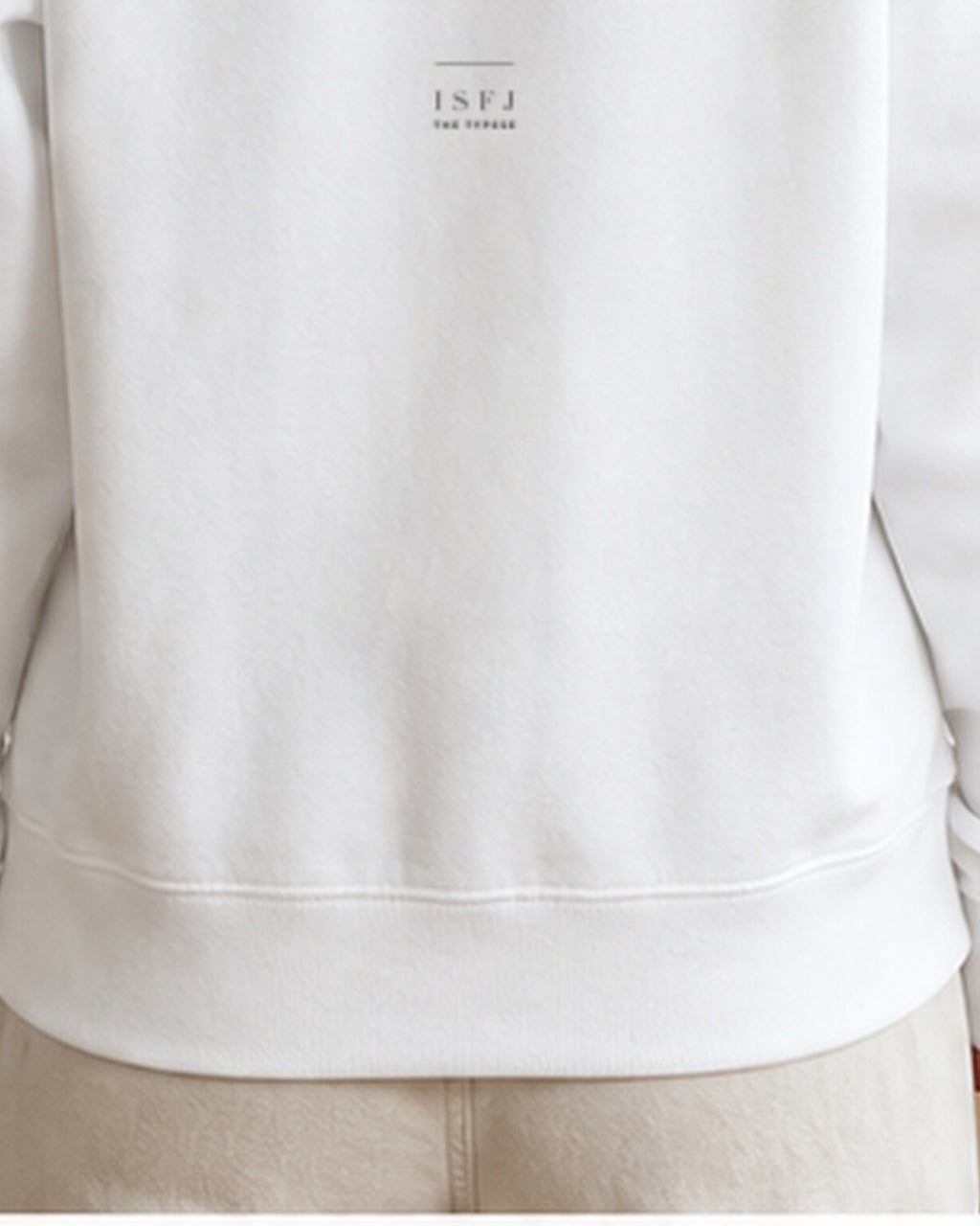 The Typese ISFJ Gildan crewneck sweatshirt in white, female back hem fleece texture