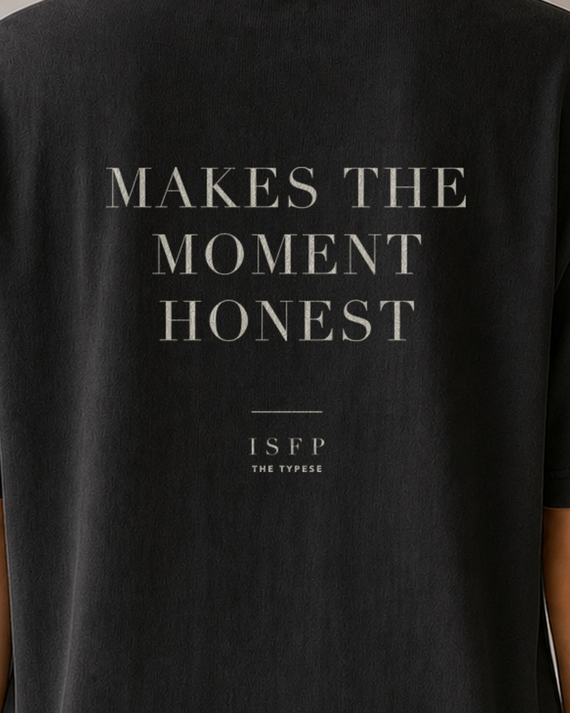The Typese ISFP Comfort Colors Tee in black, female back detail