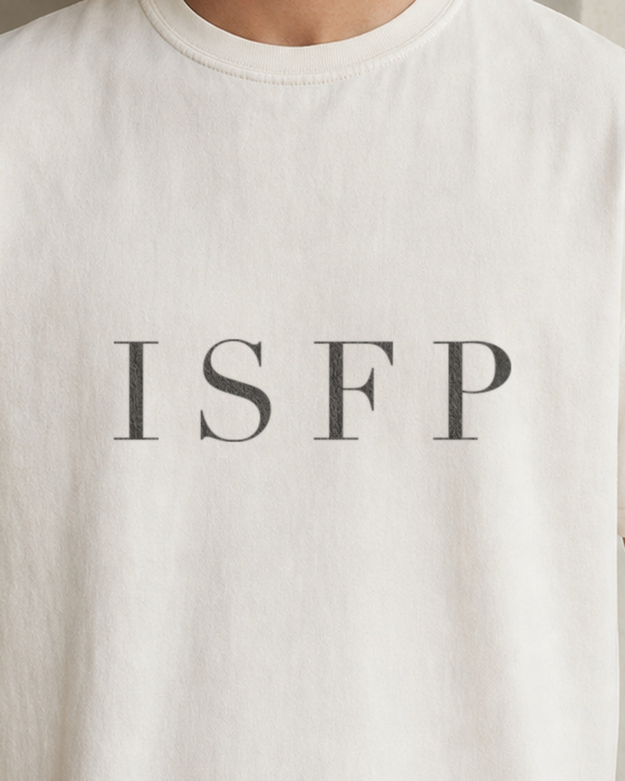 The Typese ISFP Comfort Colors Tee in cream white, male front detail