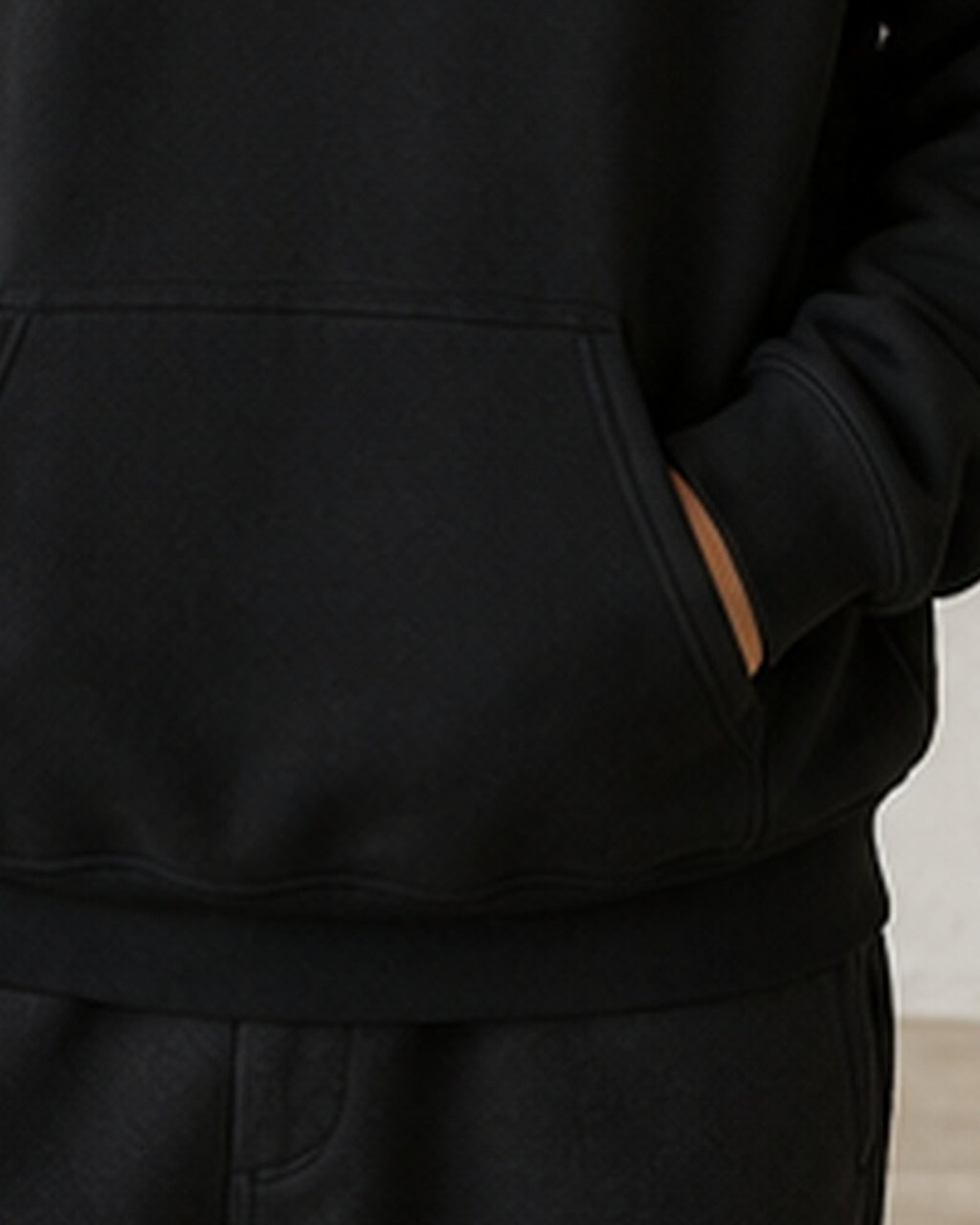 The Typese ISFP Gildan hoodie in black, hem pocket detail