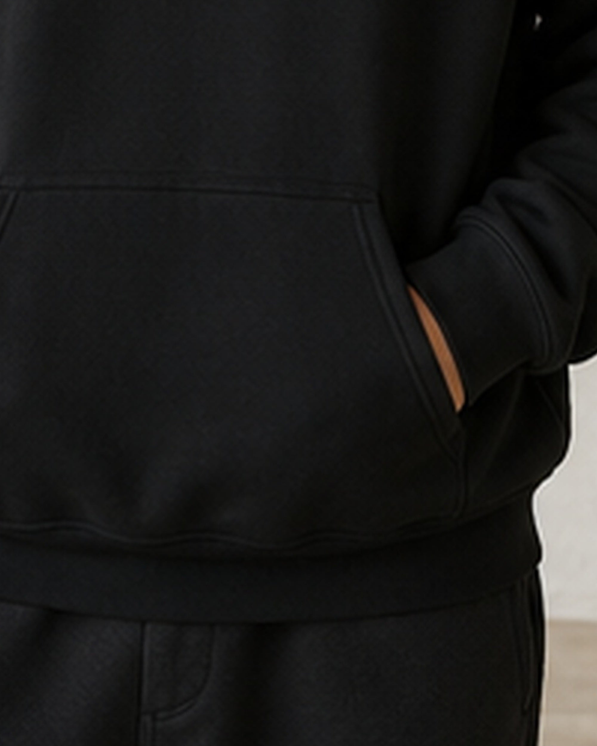 The Typese ISFP Gildan hoodie in black, hem pocket detail