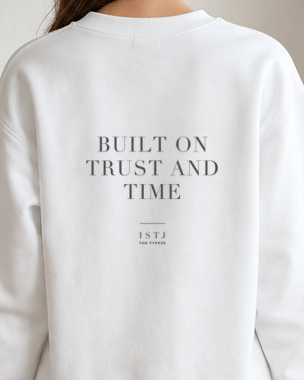The Typese ISTJ Gildan crewneck sweatshirt in white, female back detail
