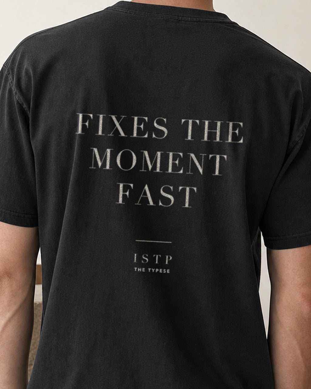 The Typese ISTP Comfort Colors Tee in black, male back detail