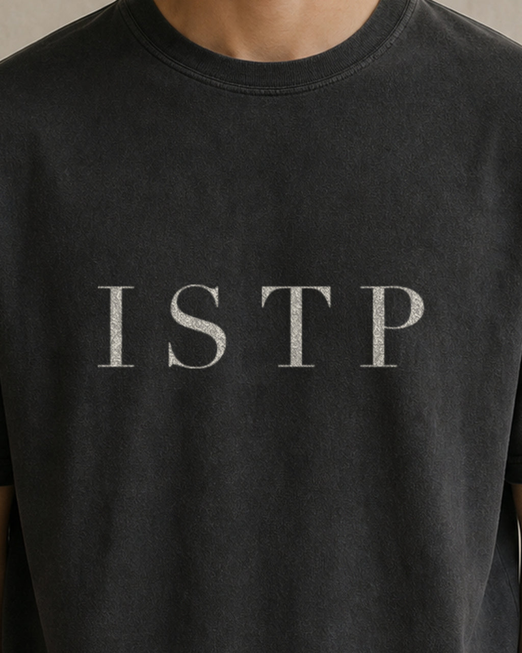 The Typese ISTP Comfort Colors Tee in black, male front detail