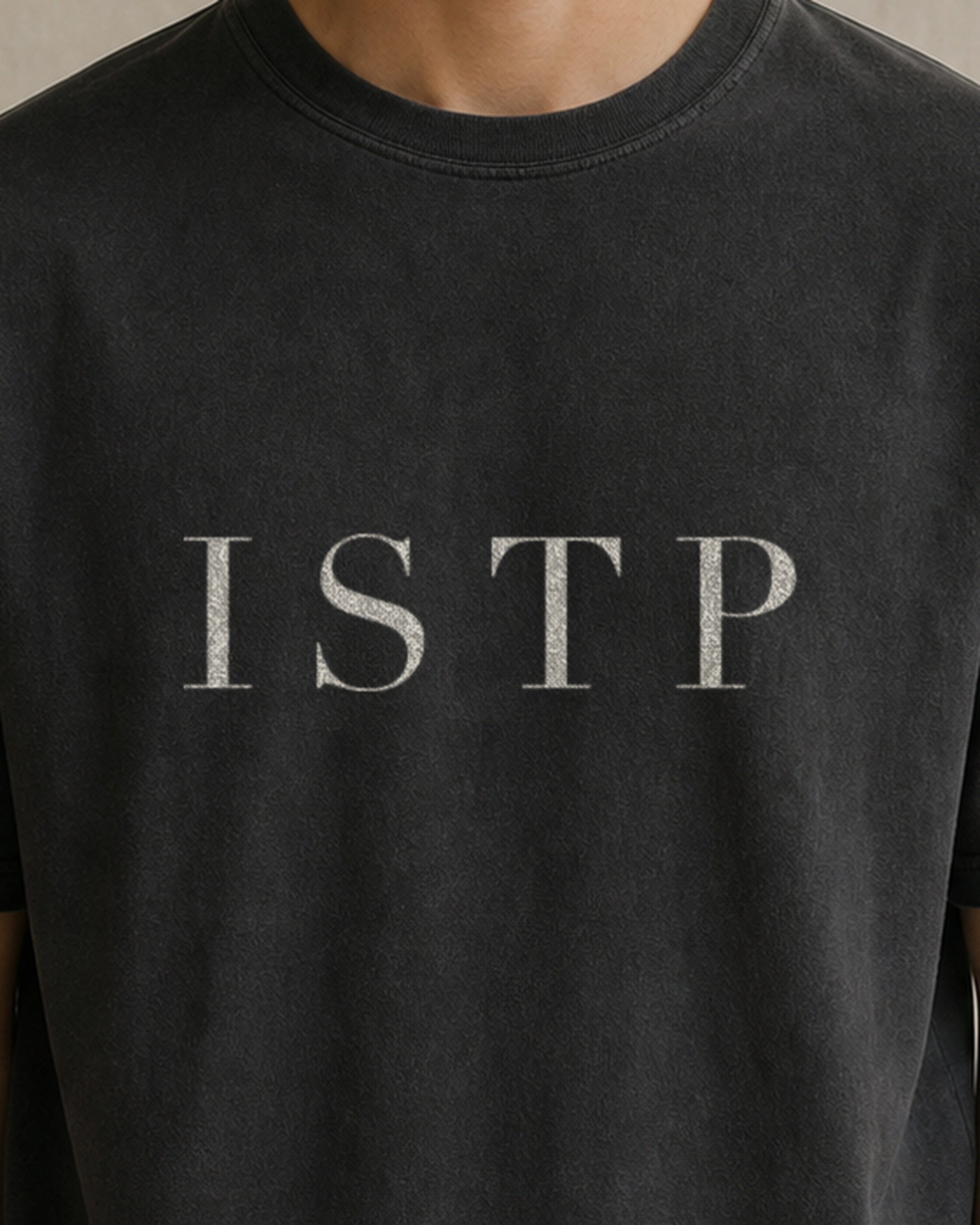 The Typese ISTP Comfort Colors Tee in black, male front detail