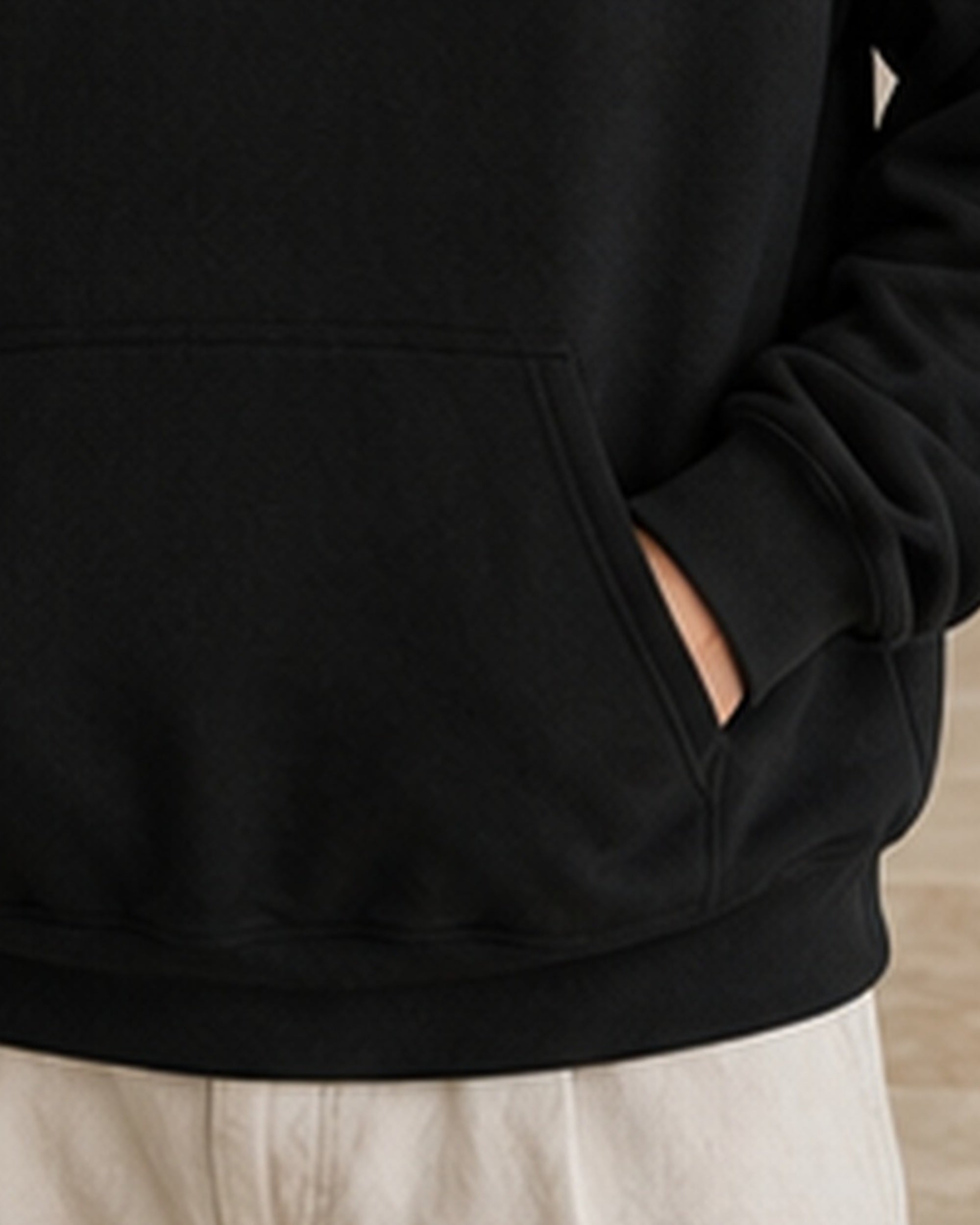 The Typese ISTP Gildan hoodie in black, hem pocket detail