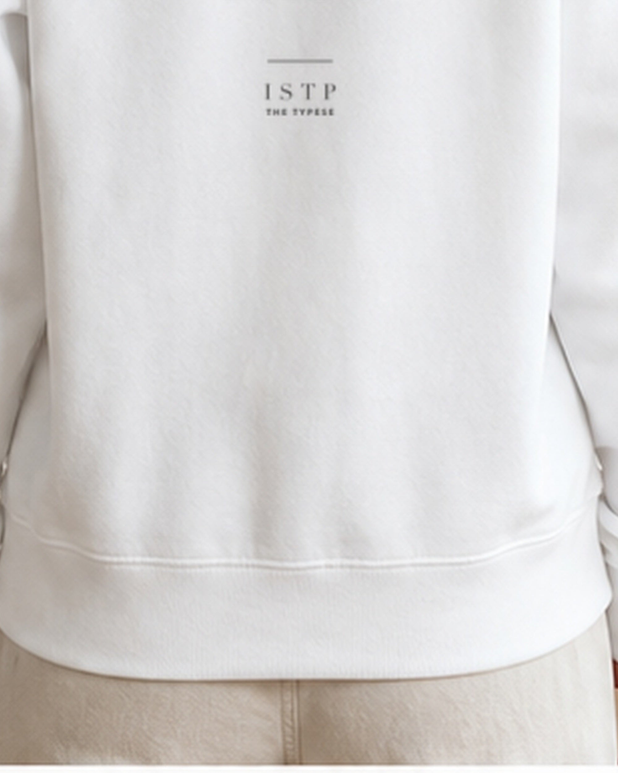 The Typese ISTP Gildan crewneck sweatshirt in white, female back hem fleece texture